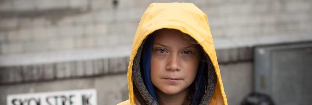 a girl in a yellow raincoat